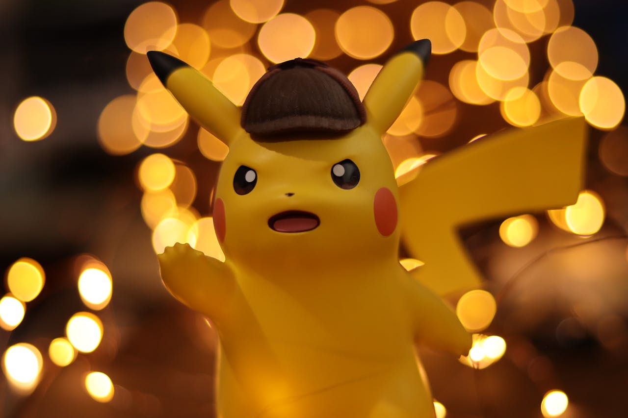 Services-02 A close-up of a Pikachu figurine illuminated by a warm bokeh effect, creating an eye-catching visual.